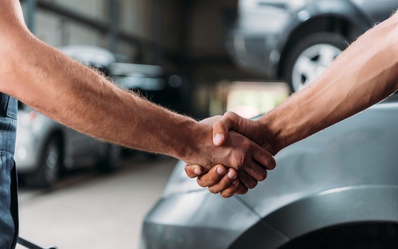 Technician shaking hands with a customer
