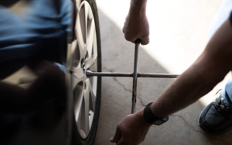 Technician performing a mobile tire change in the Greater Toronto and Hamilton Area